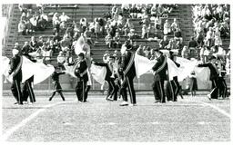 Side View of Marching Band Doing Routine with Capes (Part of the NMU Historic Photographs Collection)