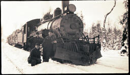 Three Men Pose with Locomotive