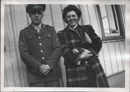 Tom and Dorotha Ross Leaning on Wall