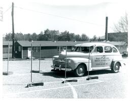 Marquette High School Driver Training Car Parking near Quonset Huts on Northern Campus (Part of the NMU Historic Photographs Collection)