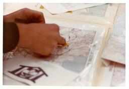 Closeup of Hands Pointing to a Map (Part of the NMU Historic Photographs Collection)