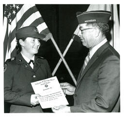 Kathryn Ann Steele Receiving Veterans of Foreign Wars Award (Part of the NMU Historic Photographs Collection)