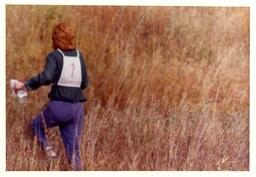 Competitor Running through a Grassy Field (Part of the NMU Historic Photographs Collection)