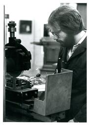 Student Sawing Piece of Metal (Part of the NMU Historic Photographs Collection)