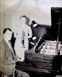 (151-02) NMC Band Concert May 25, 1960: Woman Holding Trumpet, Man at Piano