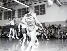 Basketball--NMC vs. Michigan Tech at Michigan Tech Feb. 22, 1961: Men Playing on Basketball Court During Game