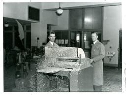 Two Men Using Belt Sander (Part of the NMU Historic Photographs Collection)