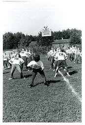 Marching Band Doing Stretches on Football Field (Part of the NMU Historic Photographs Collection)