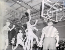 NMC Basketball--Aquinas Basketball 1960-61: Basketball Player Attempting to Score