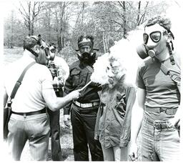 Professor Spraying Gas on Students with Gas Masks (Part of the NMU Historic Photographs Collection)