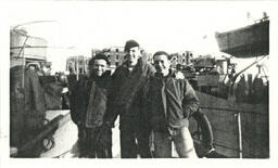 Three Men in front of Bombed Buildings