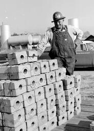 Construction Worker Posing with Parts for Mackinac Bridge