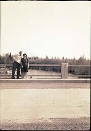 (132-016) John Dobbek and Woman on a Bridge