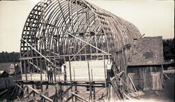 (008-020) Men Working on Scaffolding Outside Building