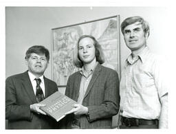 Three Men with Physics Textbook (Part of the NMU Historic Photographs Collection)