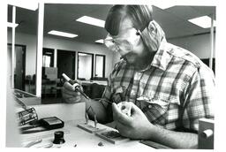 Student Soldering Wires (Part of the NMU Historic Photographs Collection)