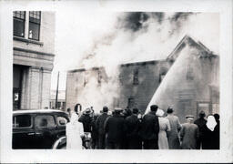 Crowd Standing in the Street Watching Furniture Store Fire (2 of 2)