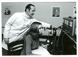 Professor Showing Student Equipment (Part of the NMU Historic Photographs Collection)