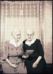 (168-009) Two old ladies looking at something