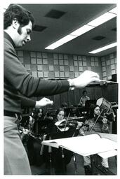 Conductor Directing Orchestra at Rehearsal (Part of the NMU Historic Photographs Collection)