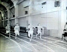 Track--Northern vs. Wayne 1960: Runner Crosses Finish Line