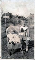 Baby and Toddler Boy with Wicker Rocking Chair