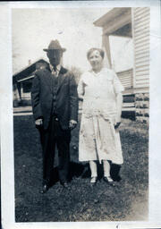 Man in Fedora with Woman