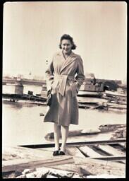 (046-001) Mrs. Harry Newton Jr. in front of Bridge and Boat