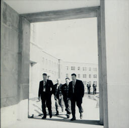 Former Campus Scenes: Four Men in Doorway