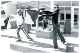 Flag Twirlers Performing Outside Forest Roberts Theater (Part of the NMU Historic Photographs Collection)