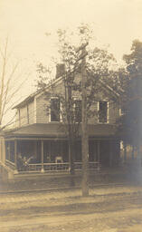 House with people on porch (2 of 2)