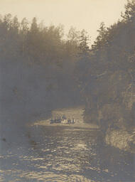 People on stony beach (view from the lake)