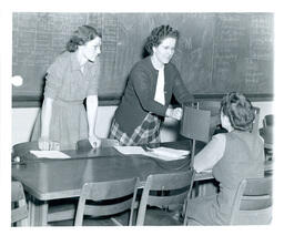 Women Administering Vision Test to Student (Part of the NMU Historic Photographs Collection)