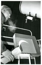 Man Working with Telescope (Part of the NMU Historic Photographs Collection)