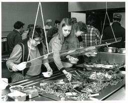 Three Students at Salad Bar (Part of the NMU Historic Photographs Collection)