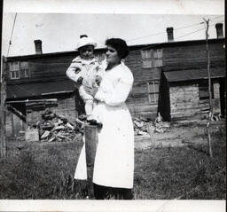 Young Tom Ross with Mother on Fencepost