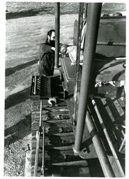 Man Working Outside on Large Machine (Part of the NMU Historic Photographs Collection)