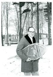 Man Holding Snowshoes (Part of the NMU Historic Photographs Collection)