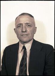 (028-012) Photograph of a Man in a Suit with a White-Collared Shirt