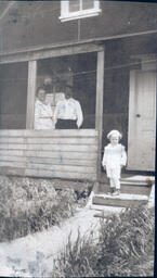 Man, Woman, and Toddler on Front Porch