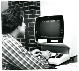 Student Typing on IBM Computer (Part of the NMU Historic Photographs Collection)