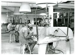 Several Students at Small Welding Stations in Shop (Part of the NMU Historic Photographs Collection)