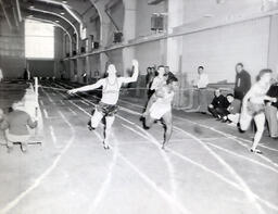 NMC Track Team 1961: Track Athletes Crossing the Finish Line