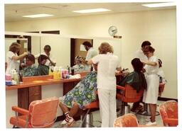 Back View of Students Cutting Customers’ Hair (Part of the NMU Historic Photographs Collection)