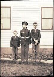 (079-004) Woman in Military Uniform with Boys