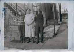 Family Photo Outside of House