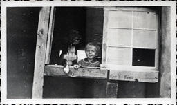 Young Tom Ross and Dog in Window