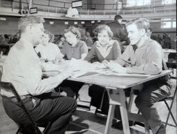 Class Registration--Dr. Schaeffer 1951: Dr. Schaeffer Helping Four Students at Class Registration