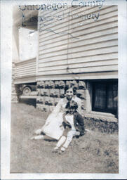 Girl Sitting with Toddler