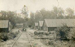 Lumber Camp with Railroad Tracks